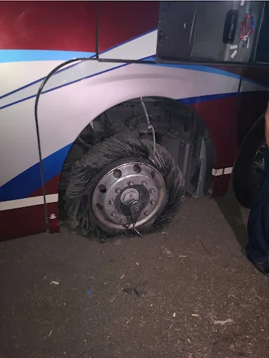 Shredded tire on a bus