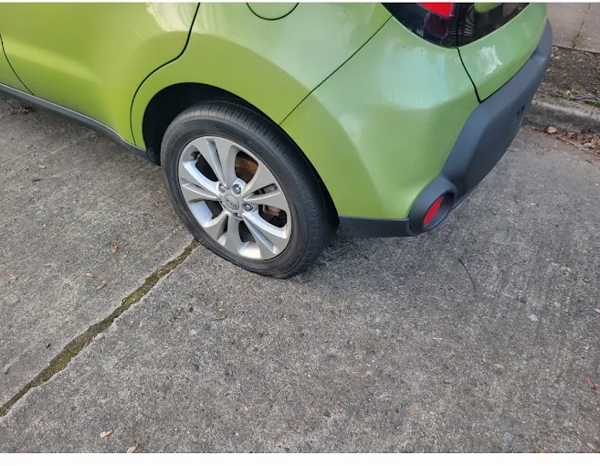 Flat tire on a compact car